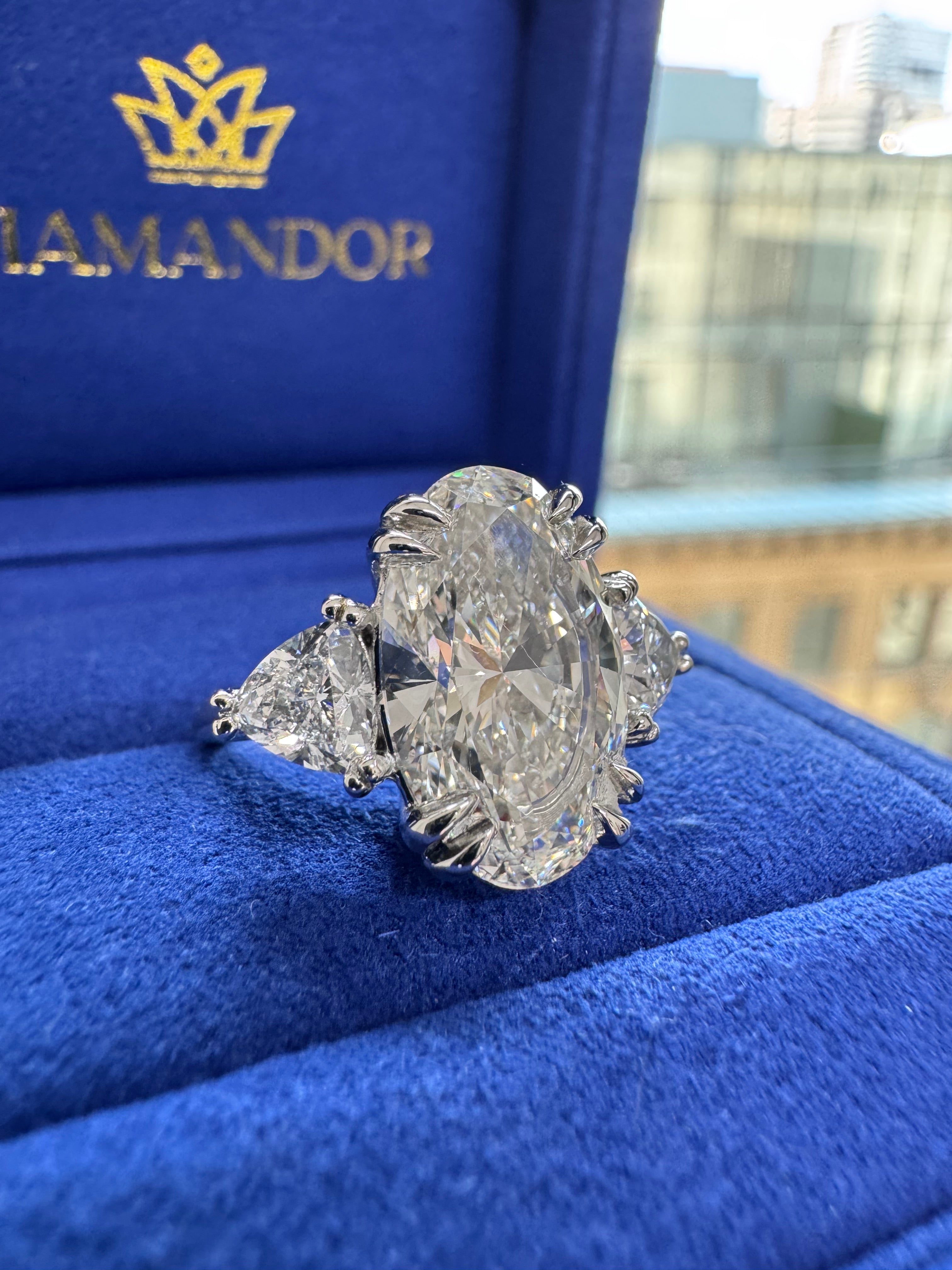 6.19 Carats Oval Diamond & 2 Trillion Cut Diamonds